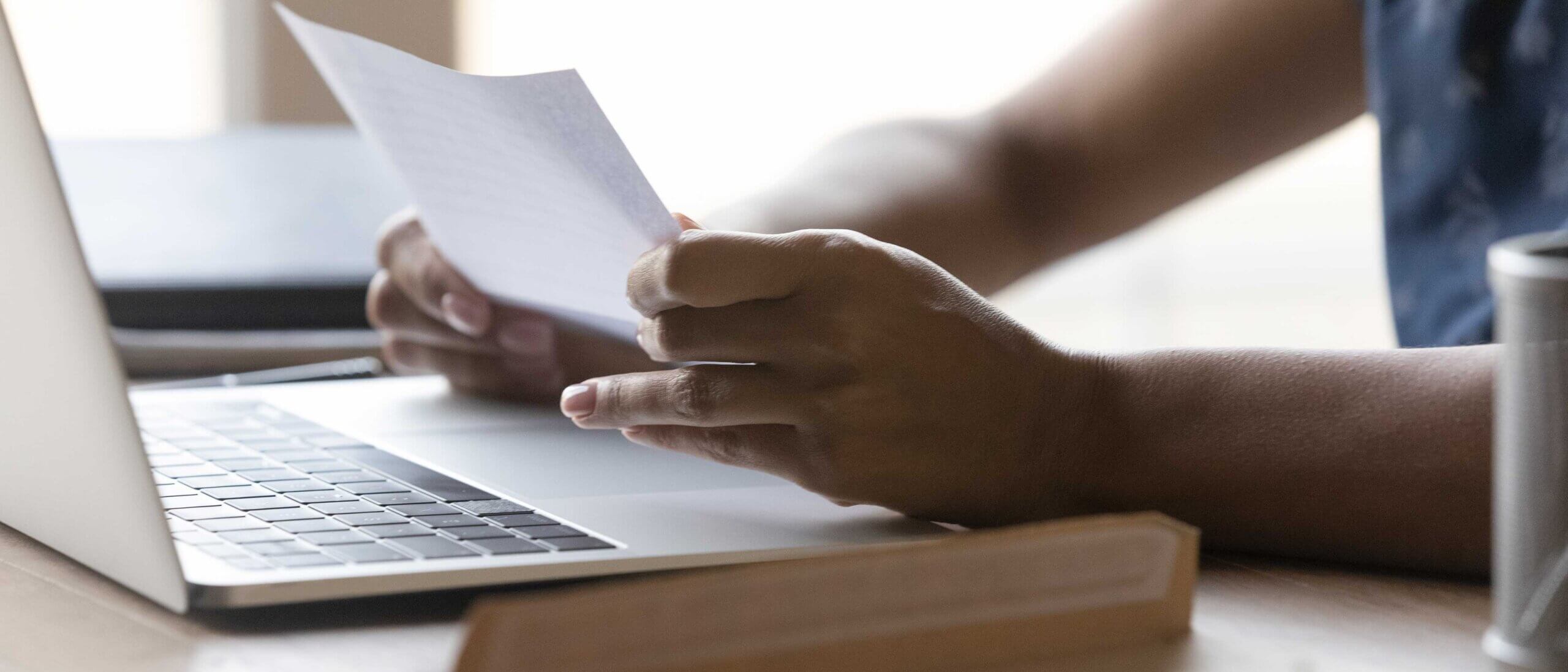 Person reviewing a revised offer letter after being recalled from furlough