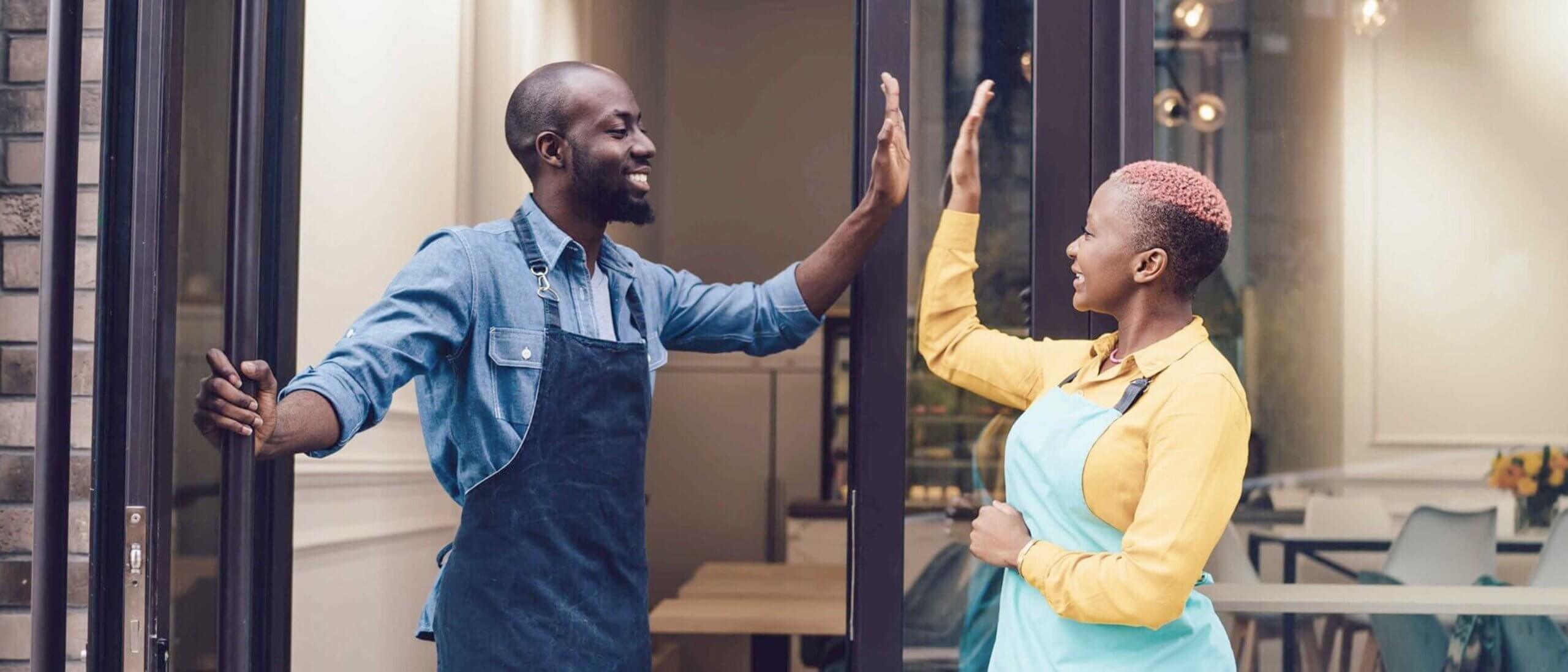 Happy employees high-fiving