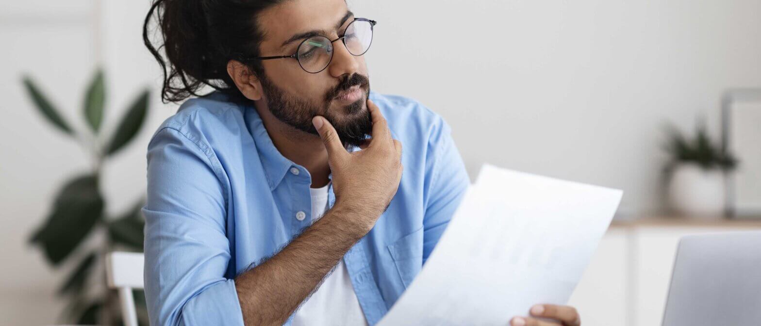 HR manager reading verification of vaccination report