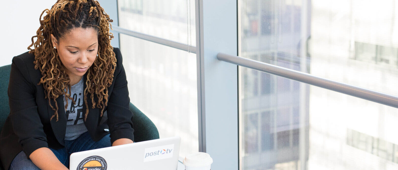 Employee Reviewing Medical Loss Ratio Rebates on Laptop