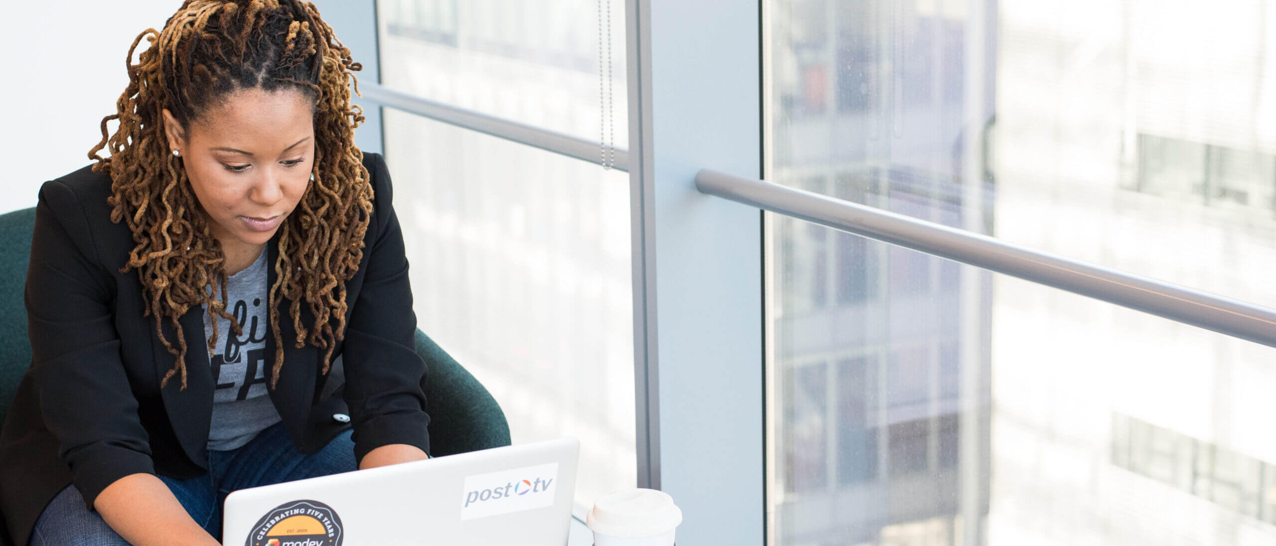 Employee Reviewing Medical Loss Ratio Rebates on Laptop