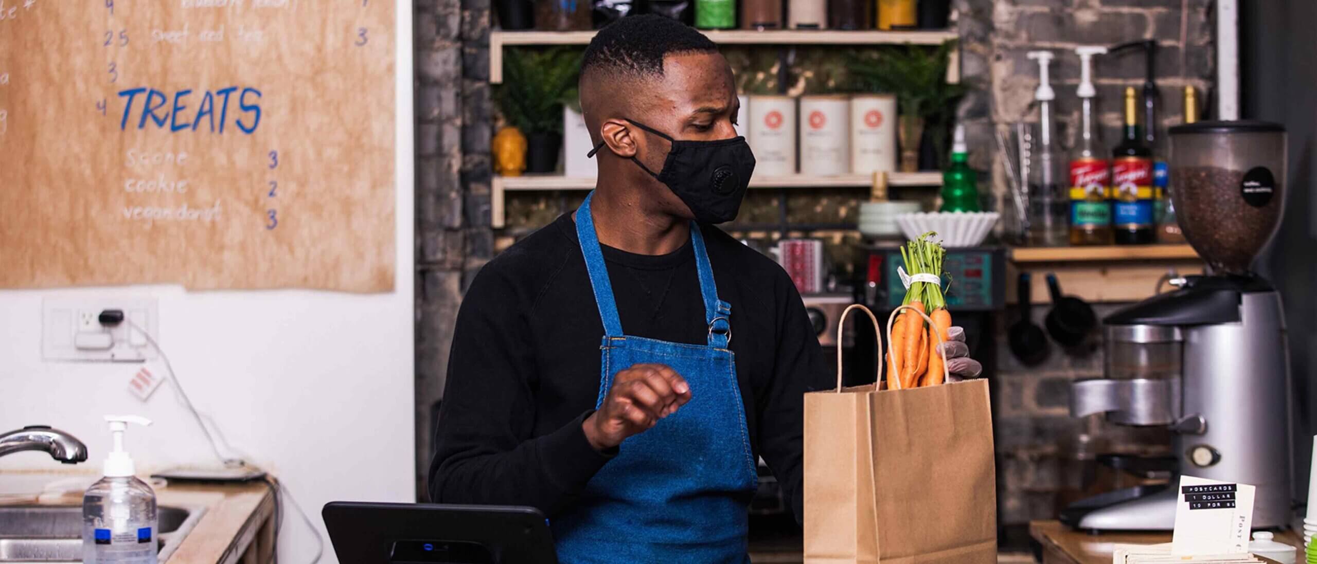 Grocery worker in a mask