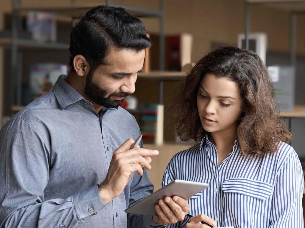 Small business owners looking at Mineral Smart Employee Handbook Plus