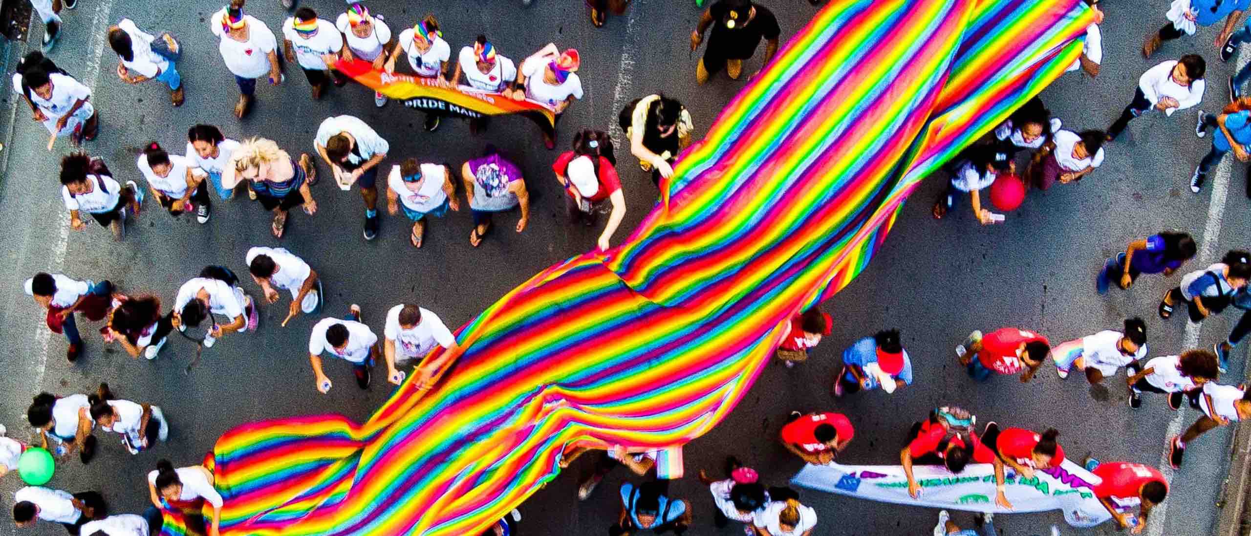 People marching with colorful banner