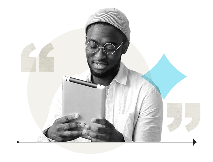 photo of man looking at a tablet device